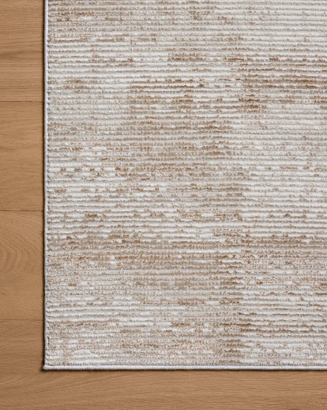 Loloi Townes TOW-03 Sand / Beige Rug - corner on wood
