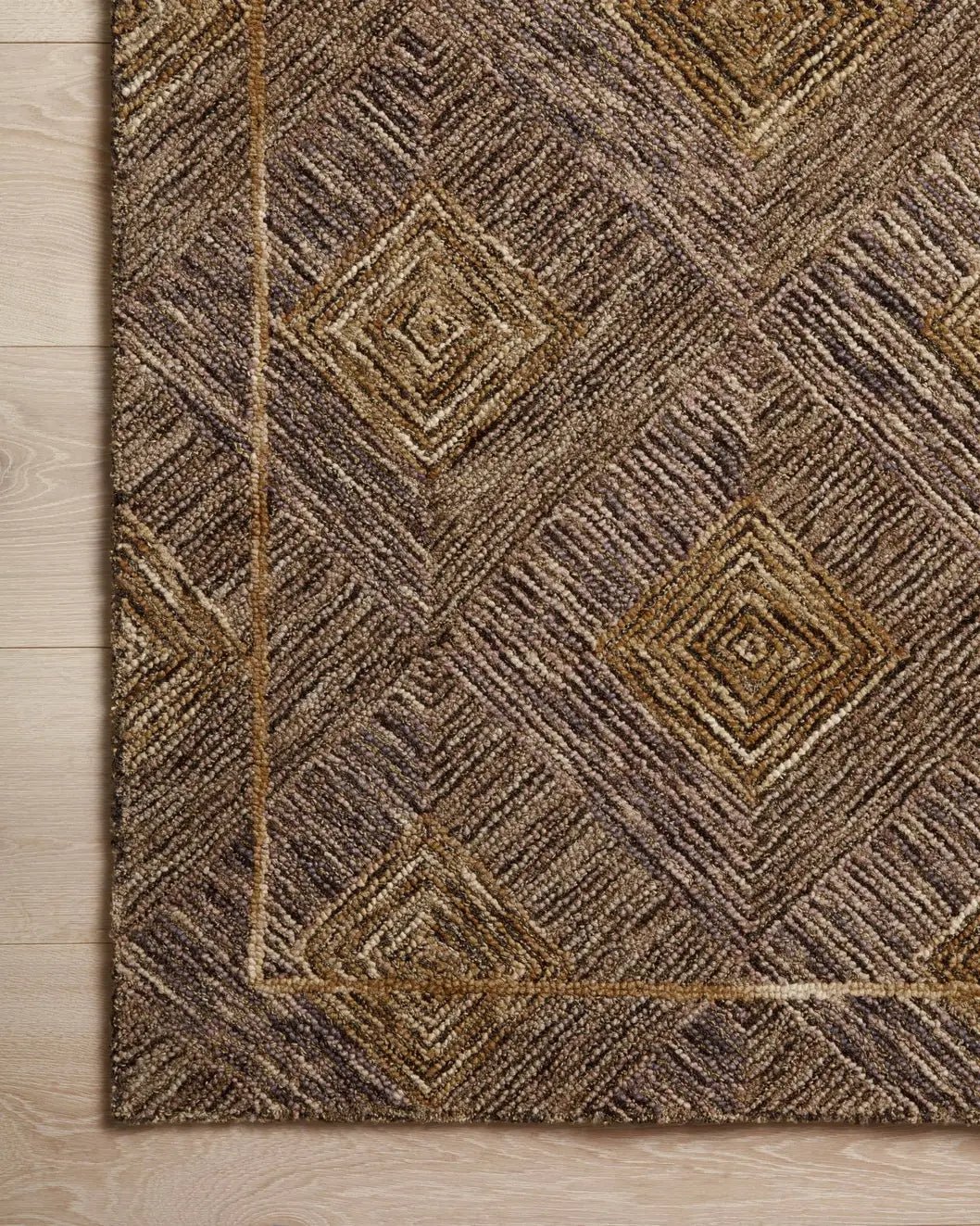 Loloi Varena Var-04 Plum/Gold Rug - corner on wood