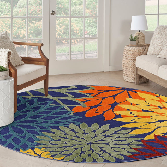 Nourison Aloha multicolor round rug with navy floral medallion and orange petal design