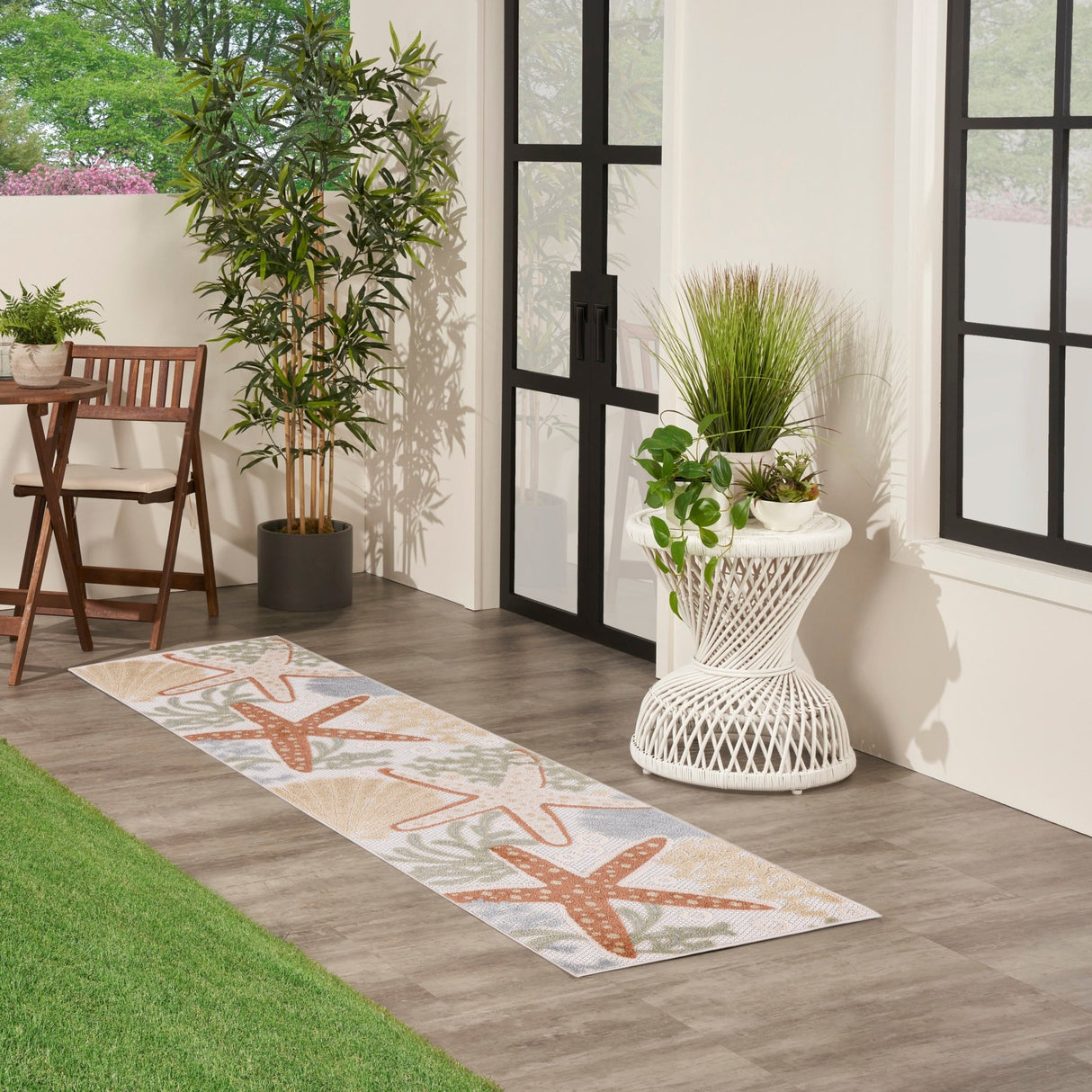 Ivory multicolor runner rug with orange and green starfish motifs