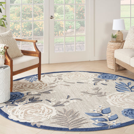 Nourison Aloha blue-gray and ivory round rug with floral medallion and leaf motifs