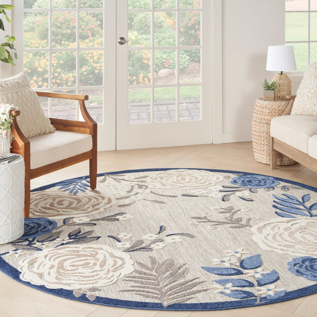 Nourison Aloha blue-gray and ivory round rug with floral medallion and leaf motifs