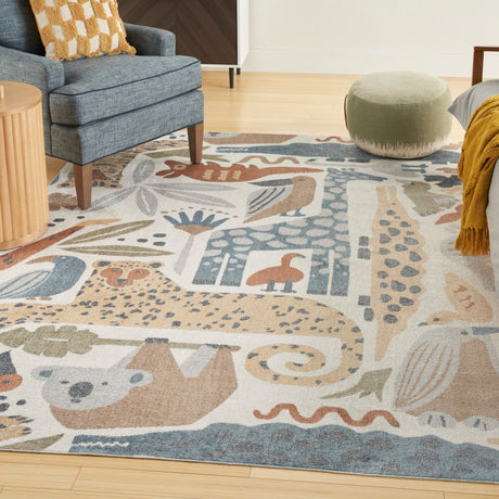 Ivory rectangular area rug with layered animal prints in blue, tan, and rust