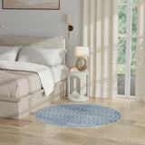 Blue round geometric rug with repeating trellis and cross pattern