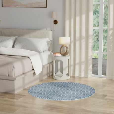 Blue round geometric rug with repeating trellis and cross pattern