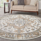 Round silver grey rug with large ornate medallion and blue/tan motifs