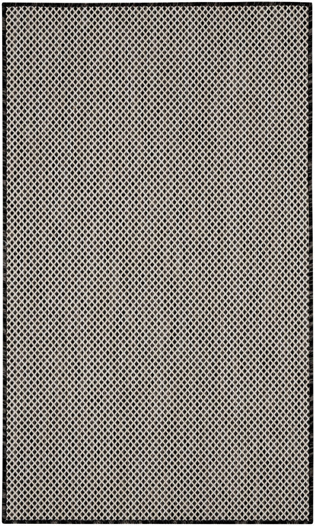 Black and white geometric lattice area rug with dark outer frame