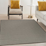 Black and white lattice area rug with textured grid pattern border