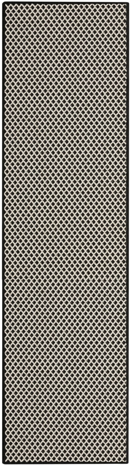 Black and white long rectangular rug with repeating lattice design