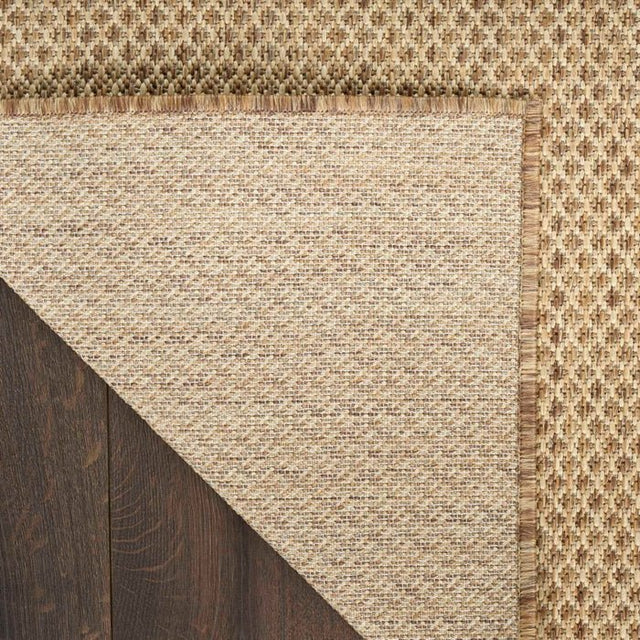 Jute rug corner with tight weave and braided border trim