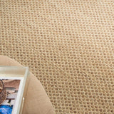 Tan jute rug with close diamond weave texture