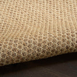 Jute rug pile with tight woven texture and subtle edge border