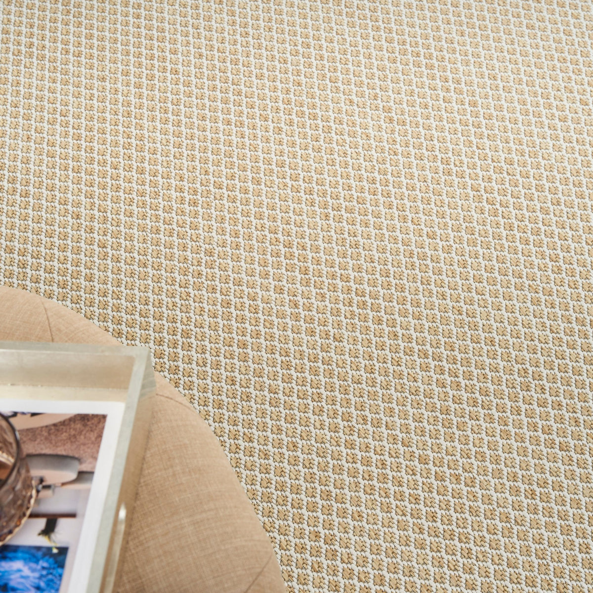 Corner close-up of natural lattice woven rug with tan border and dense texture