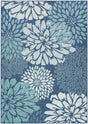 Navy and light blue rectangular area rug with large white flower and leaf pattern