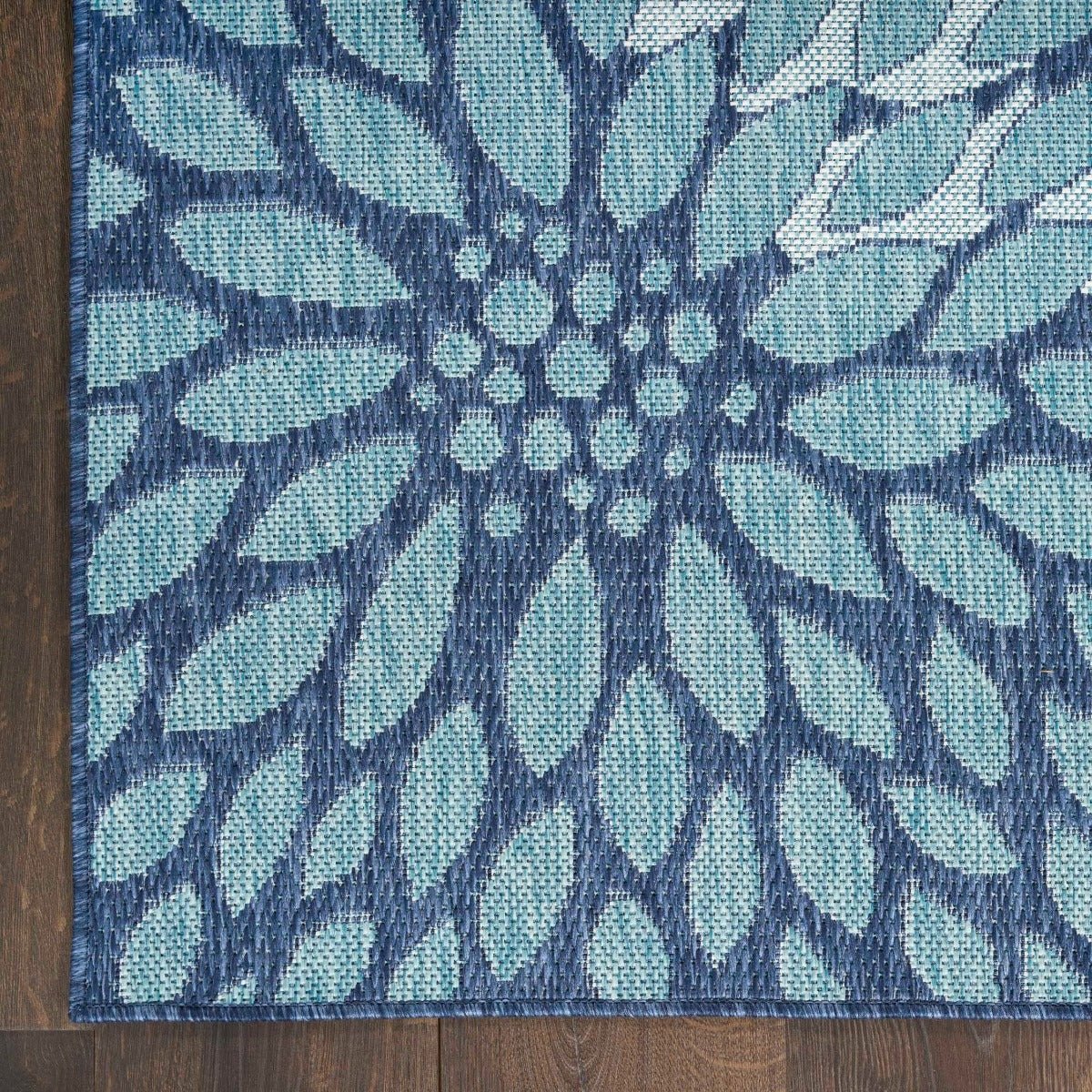 Navy and light blue floral area rug with radial botanical pattern in square view