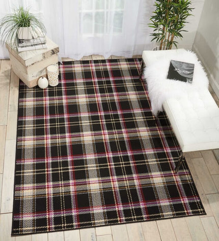 Black rectangle plaid area rug with cream, red, purple, and gold check pattern