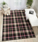 Black rectangle plaid area rug with cream, red, purple, and gold check pattern