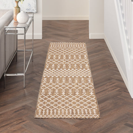 Rectangular jute rug with tan base and white diamond pattern, full view