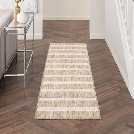 Rectangular beige and ivory striped rug with textured horizontal lines