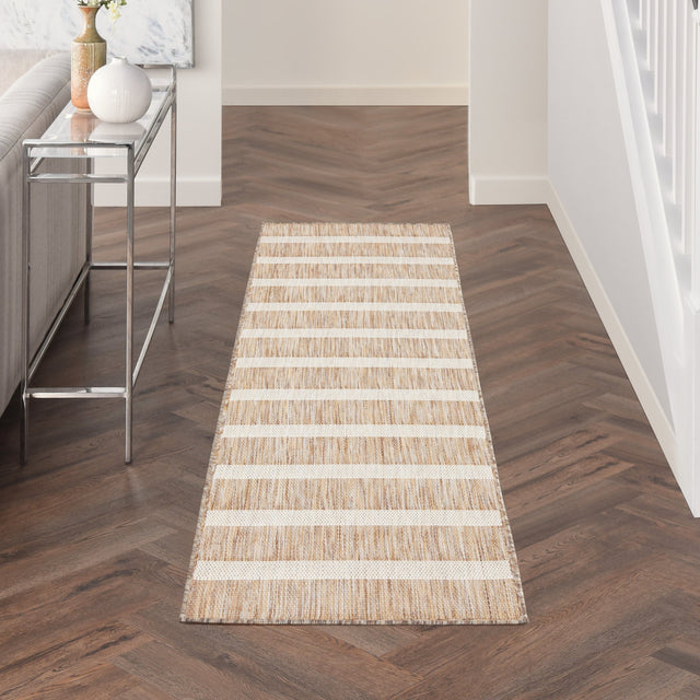 Rectangular beige and ivory striped rug with textured horizontal lines
