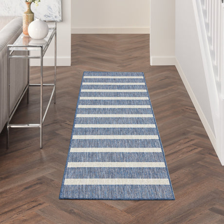 Rectangular navy and ivory striped runner rug with bordered edges