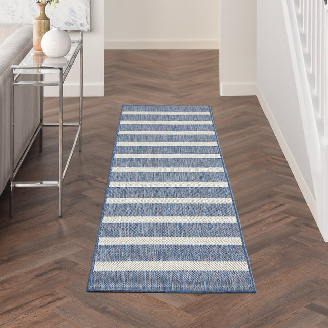 Rectangular navy and ivory striped runner rug with bordered edges