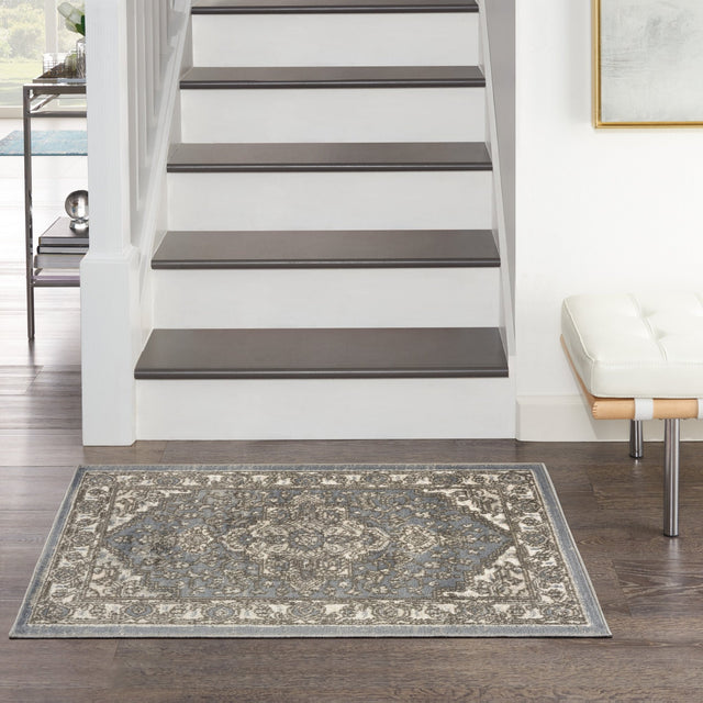 Blue and gray vintage-style rectangular area rug with central medallion