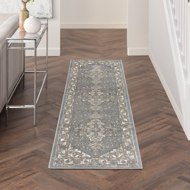 Blue and gray vintage-style rectangular area rug with ornate border