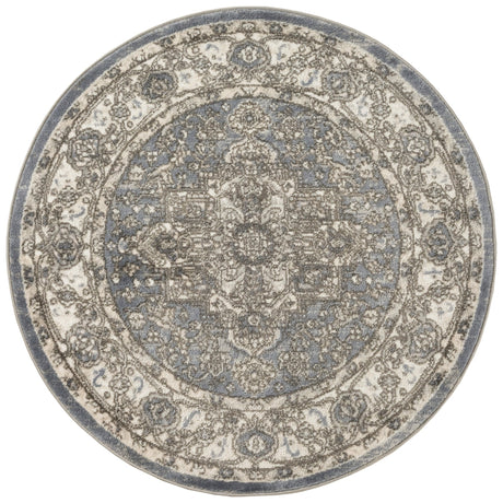 Blue and gray vintage-style round area rug with ornate central pattern