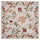 Ivory area rug with colorful floral vines and ornate border