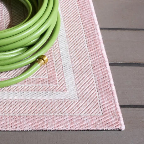 Safavieh Courtyard 5'-3" x 7'-7" Rug in Ivory / Pink