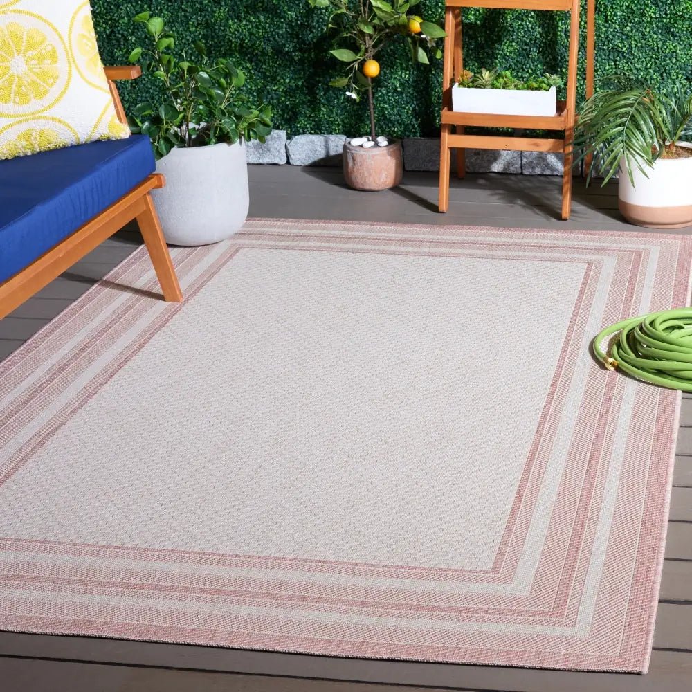 Safavieh Courtyard 5'-3" x 7'-7" Rug in Ivory / Pink