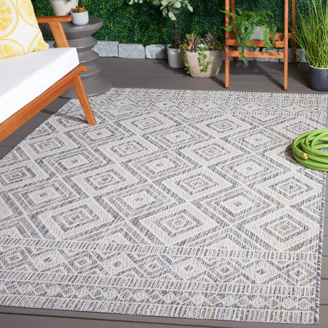 Safavieh Courtyard 5'-3" x 7'-7" Rug in Ivory Blue / Beige