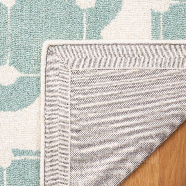 Safavieh Safavieh Kids Sfk927K Turquoise/Ivory Rug.