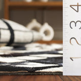 Safavieh Studio Leather 4'-0" x 6'-0" Rug in Black / Ivory