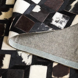 Safavieh Studio Leather 4'-0" x 6'-0" Rug in Black / Ivory