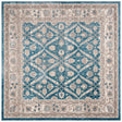 Blue and beige geometric area rug with ornate medallion diamonds