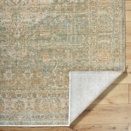 Handmade area rug with pale beige and blue tile-style pattern and decorative border edge