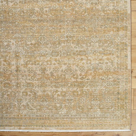 Handmade rug with beige and gold geometric pattern, rectangular border