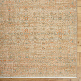 Handmade rectangular rug with ornate vintage pattern, beige tan with orange and blue accents