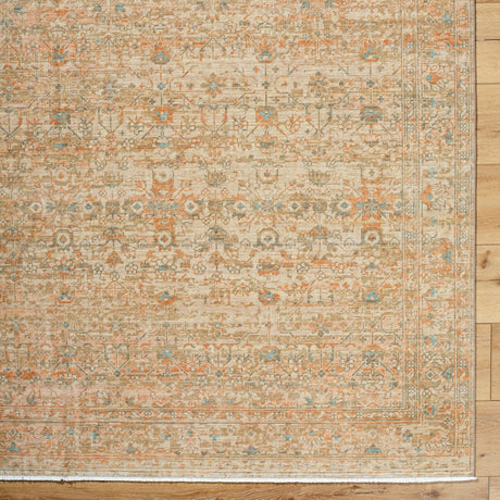 Handmade rectangular rug with ornate vintage pattern, beige tan with orange and blue accents