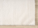 United Weavers Lavish Solid United Weavers Lavish Solid Plush Beige Rug - angle view