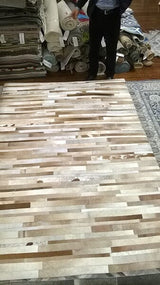 Safavieh Studio Leather Stl218B Tan / Ivory Rugs.